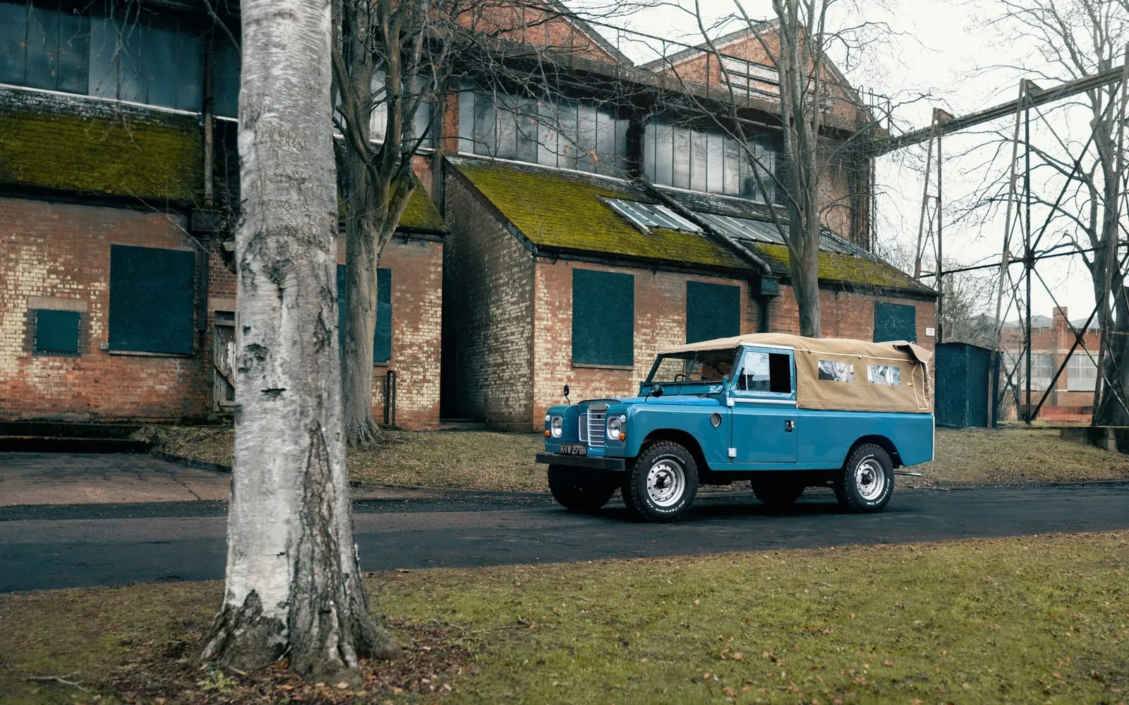 A blue truck parked in front of a building
