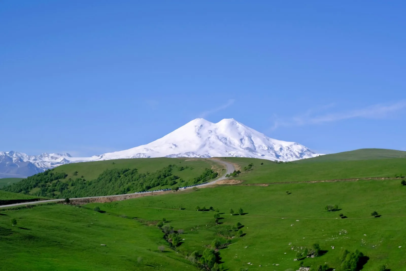 a snowy mountain in the distance