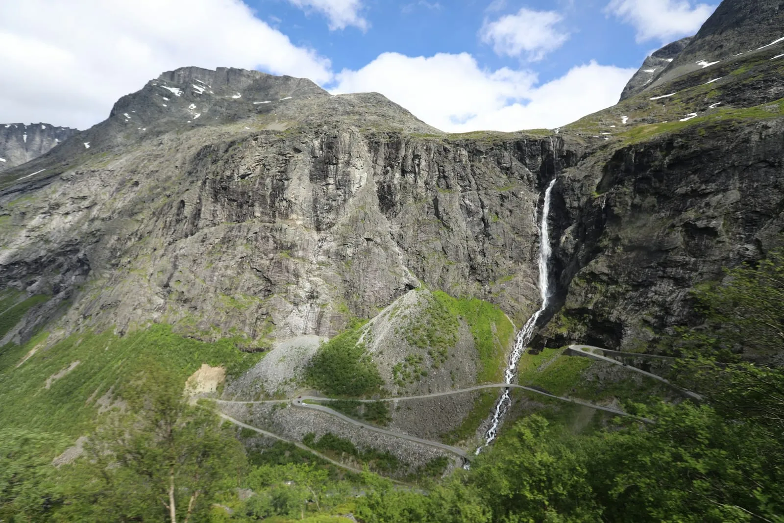 Waterfall cascades down a steep mountain.
